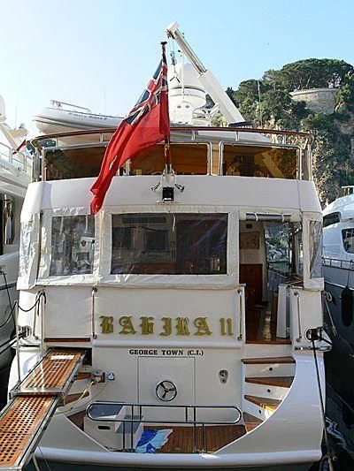 a boat with a flag on the front aboard BAHIRA II Yacht for Sale