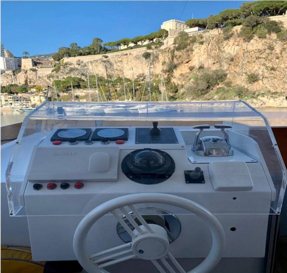 a white car with a black dashboard aboard BAHIRA II Yacht for Sale