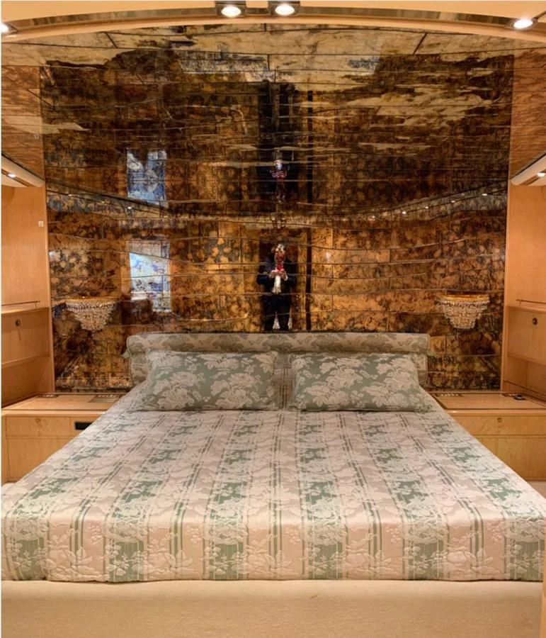 a person standing on a bed aboard BAHIRA II Yacht for Sale