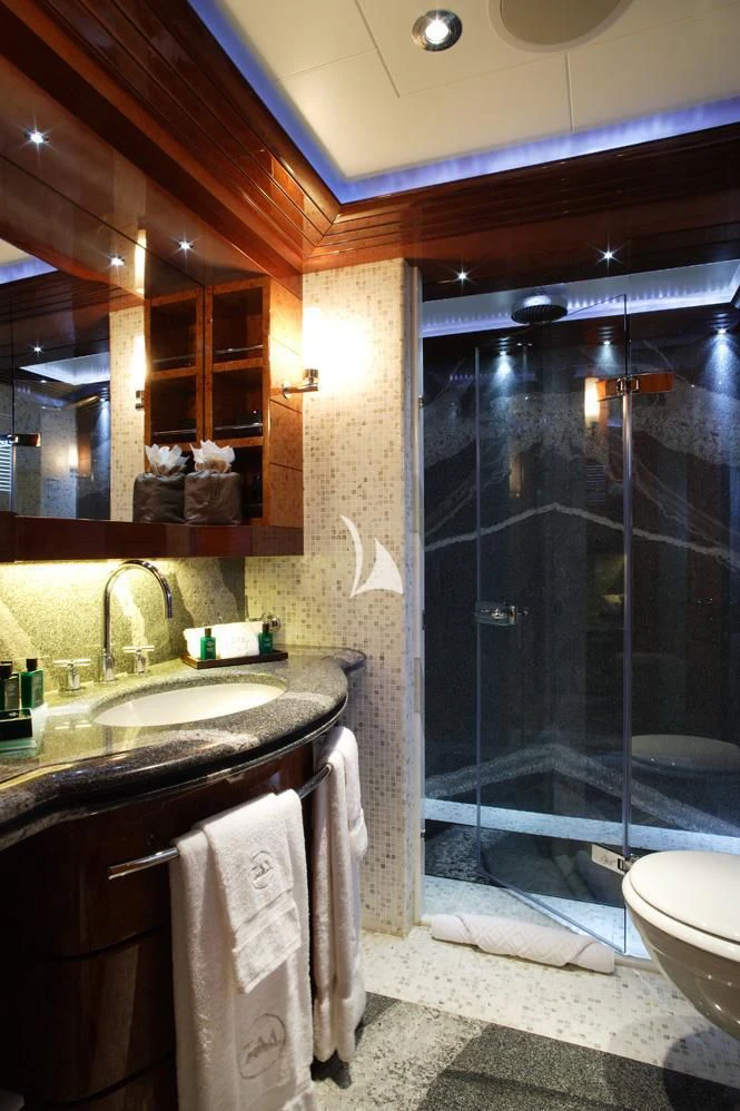 a bathroom with a glass shower aboard TALISMAN MAITON Yacht for Charter