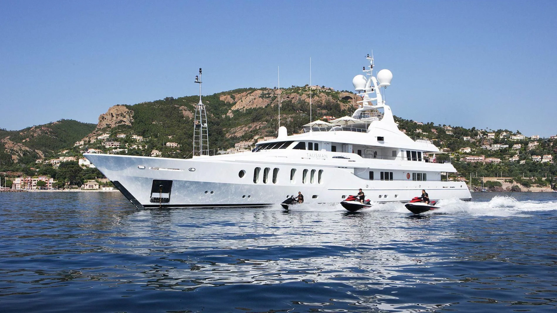 a large white boat with a couple people in it aboard TALISMAN MAITON Yacht for Charter