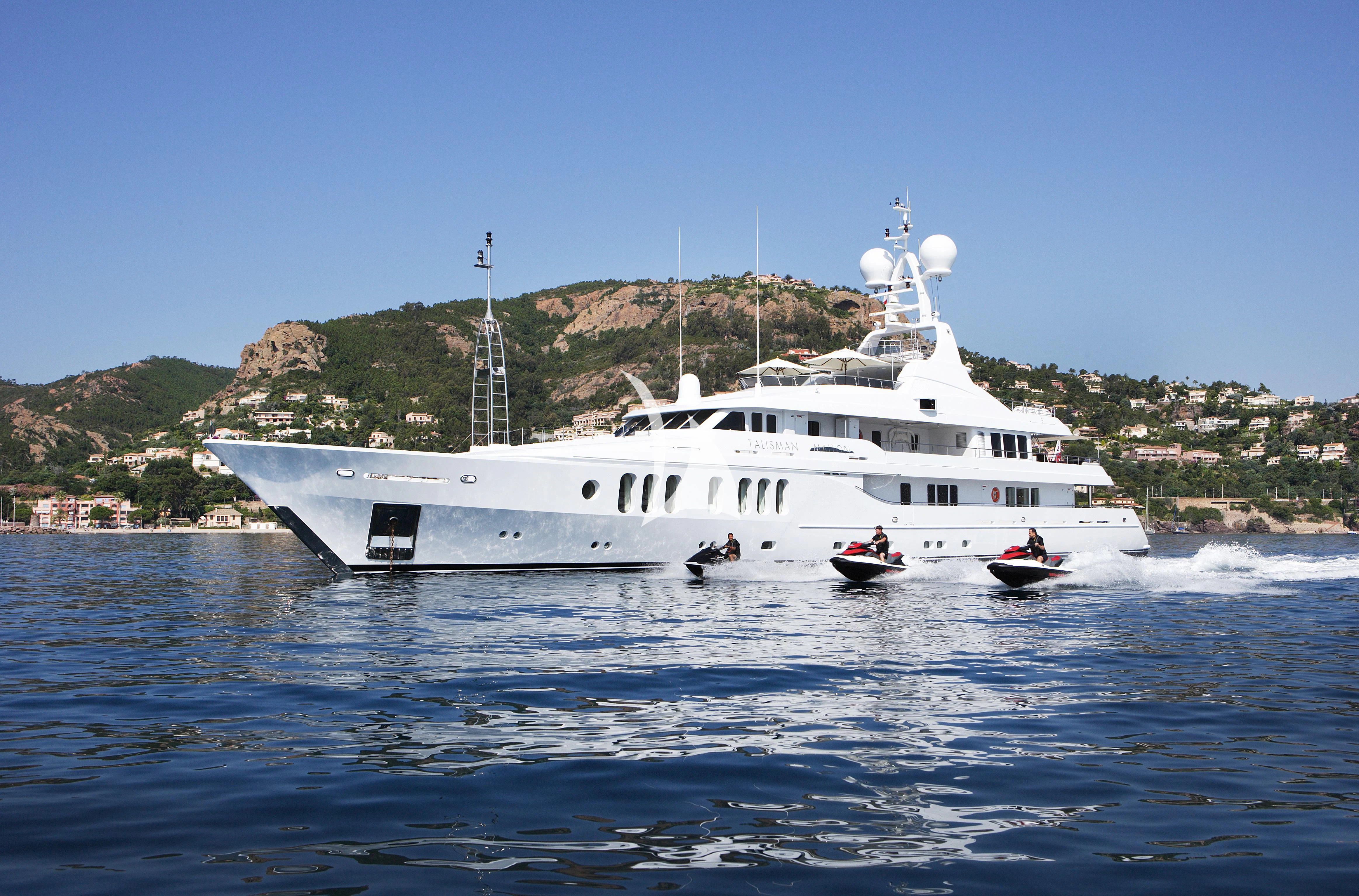 a large white boat on the water aboard TALISMAN MAITON Yacht for Charter