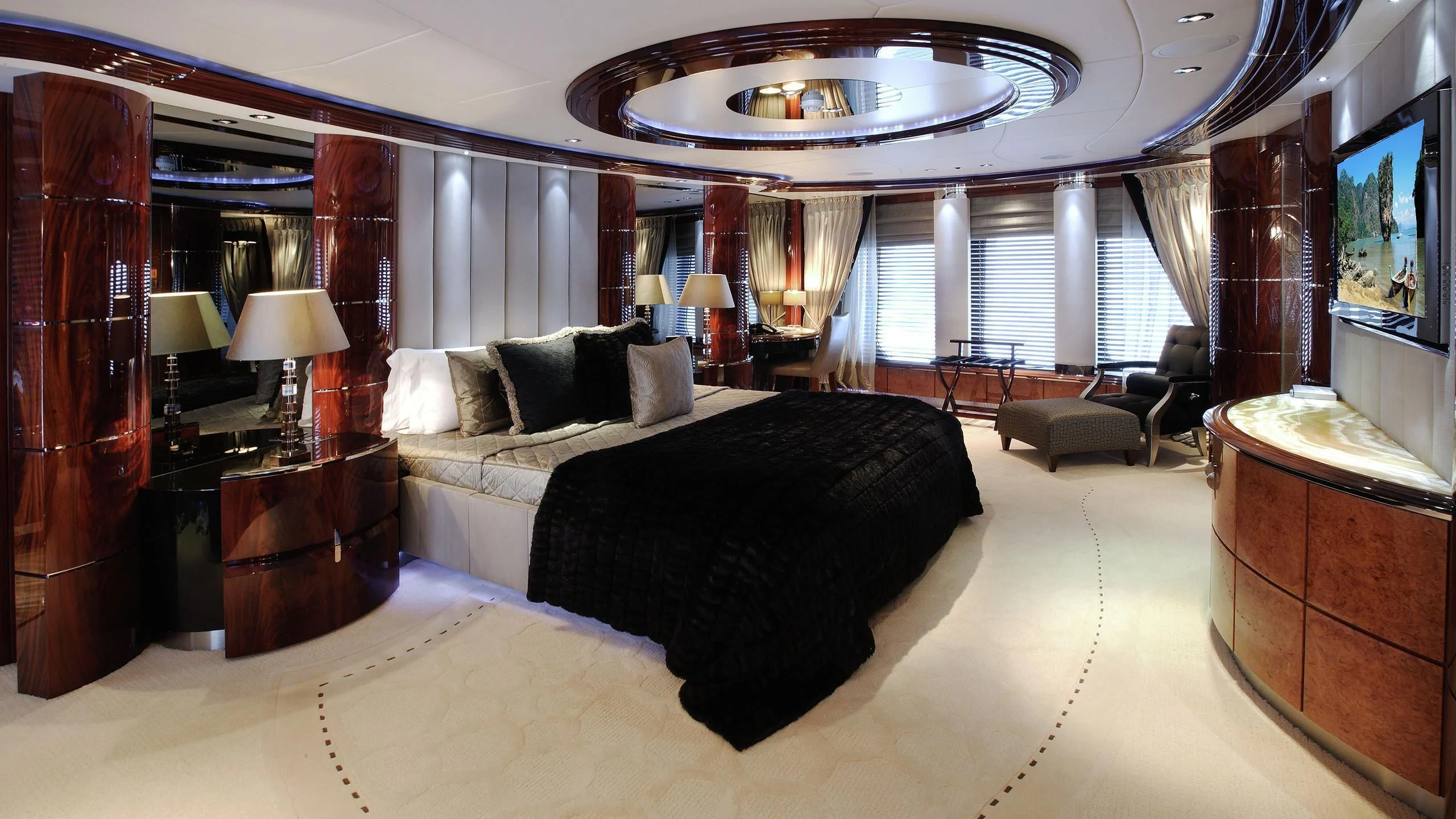 a large bedroom with a large bed aboard TALISMAN MAITON Yacht for Charter