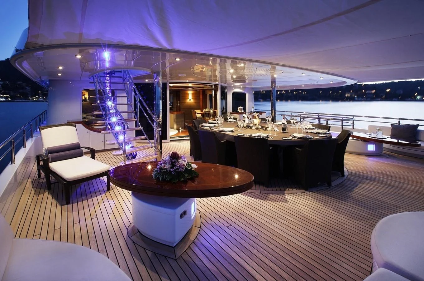 a room with a table and chairs aboard TALISMAN MAITON Yacht for Charter