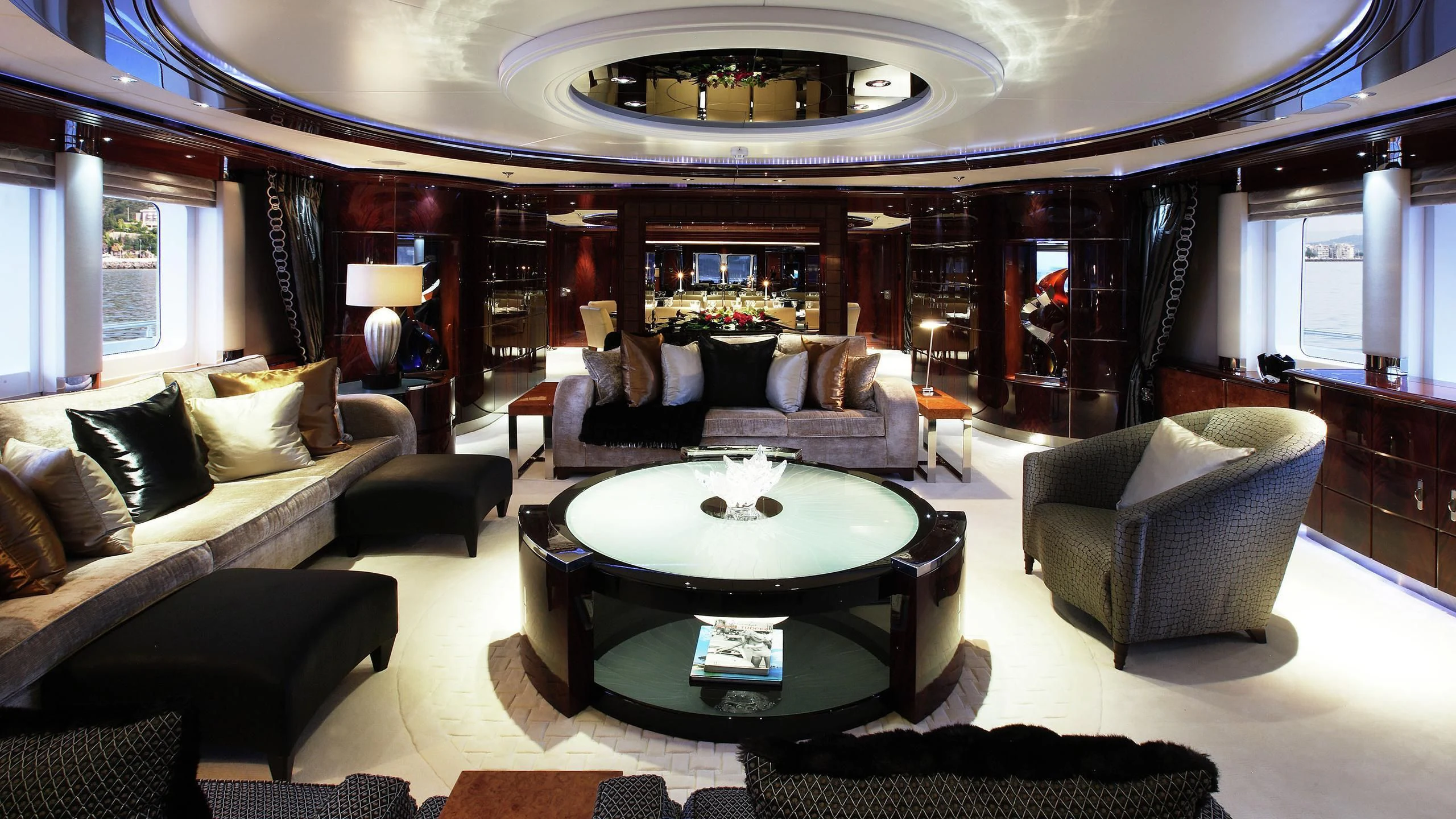 a living room with a large mirror aboard TALISMAN MAITON Yacht for Charter