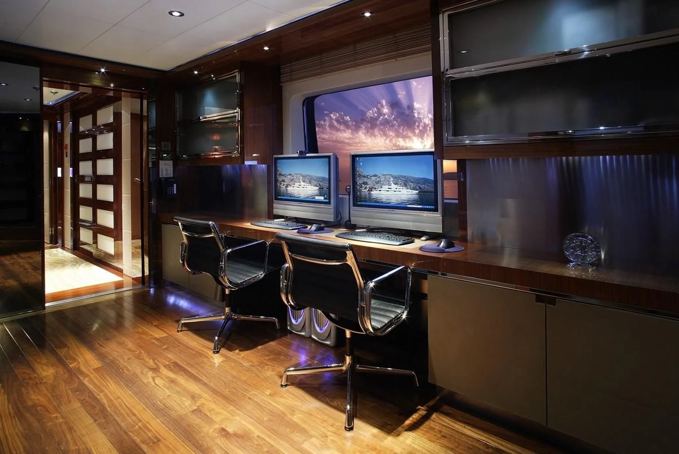a room with a desk and computer aboard TALISMAN MAITON Yacht for Charter