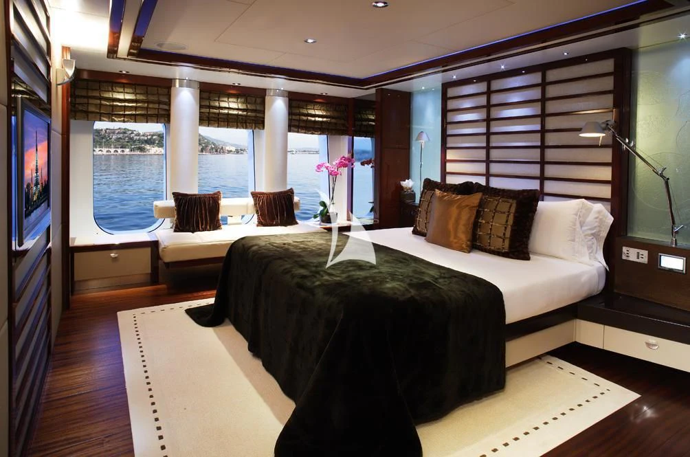a room with a bed and a tv aboard TALISMAN MAITON Yacht for Charter