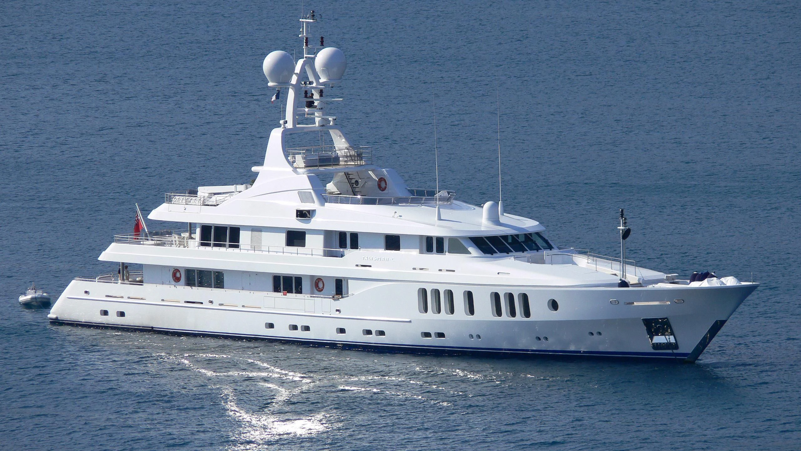 a large white boat in the water aboard TALISMAN MAITON Yacht for Charter
