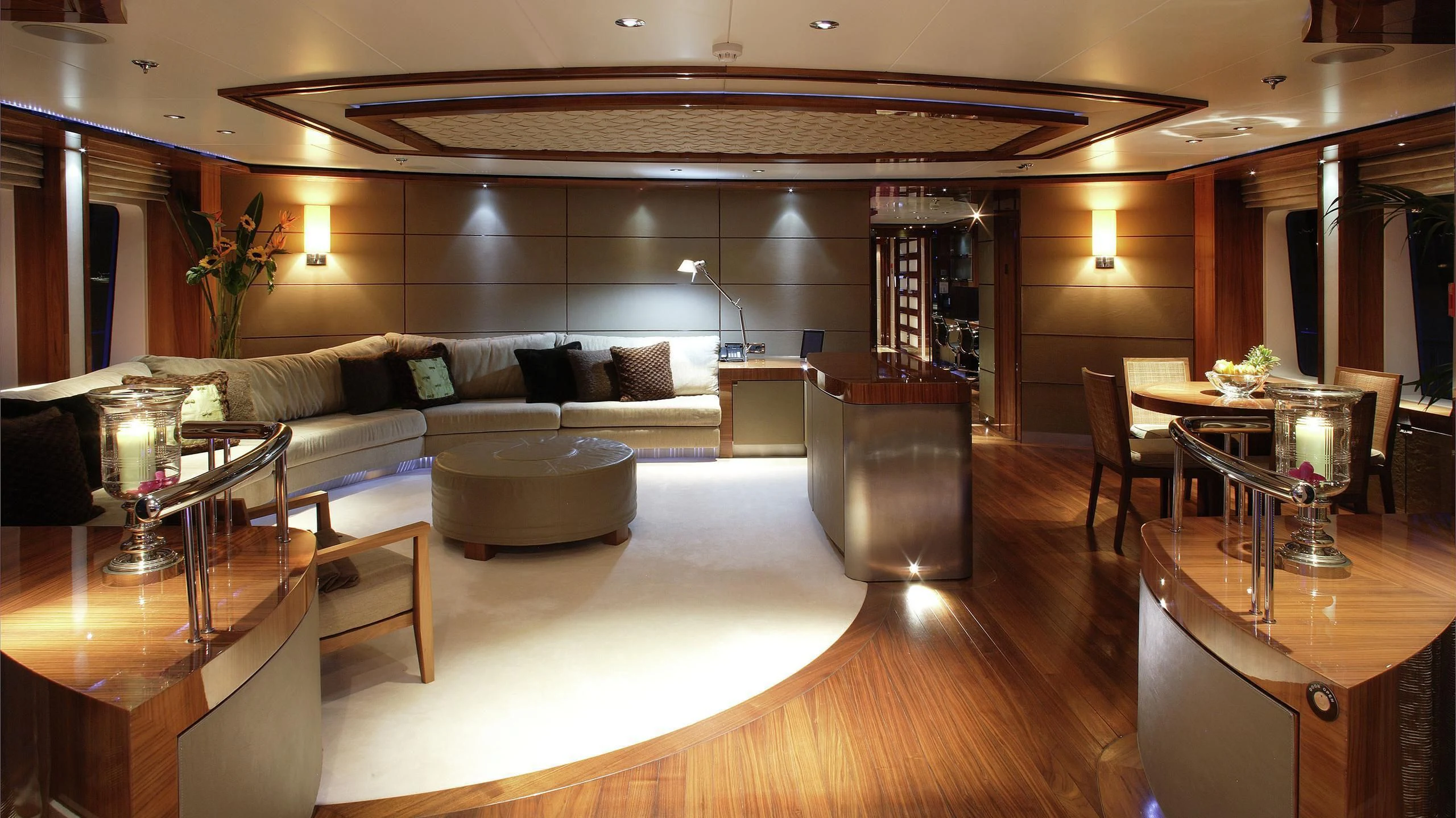 a large room with a couch and a table aboard TALISMAN MAITON Yacht for Charter