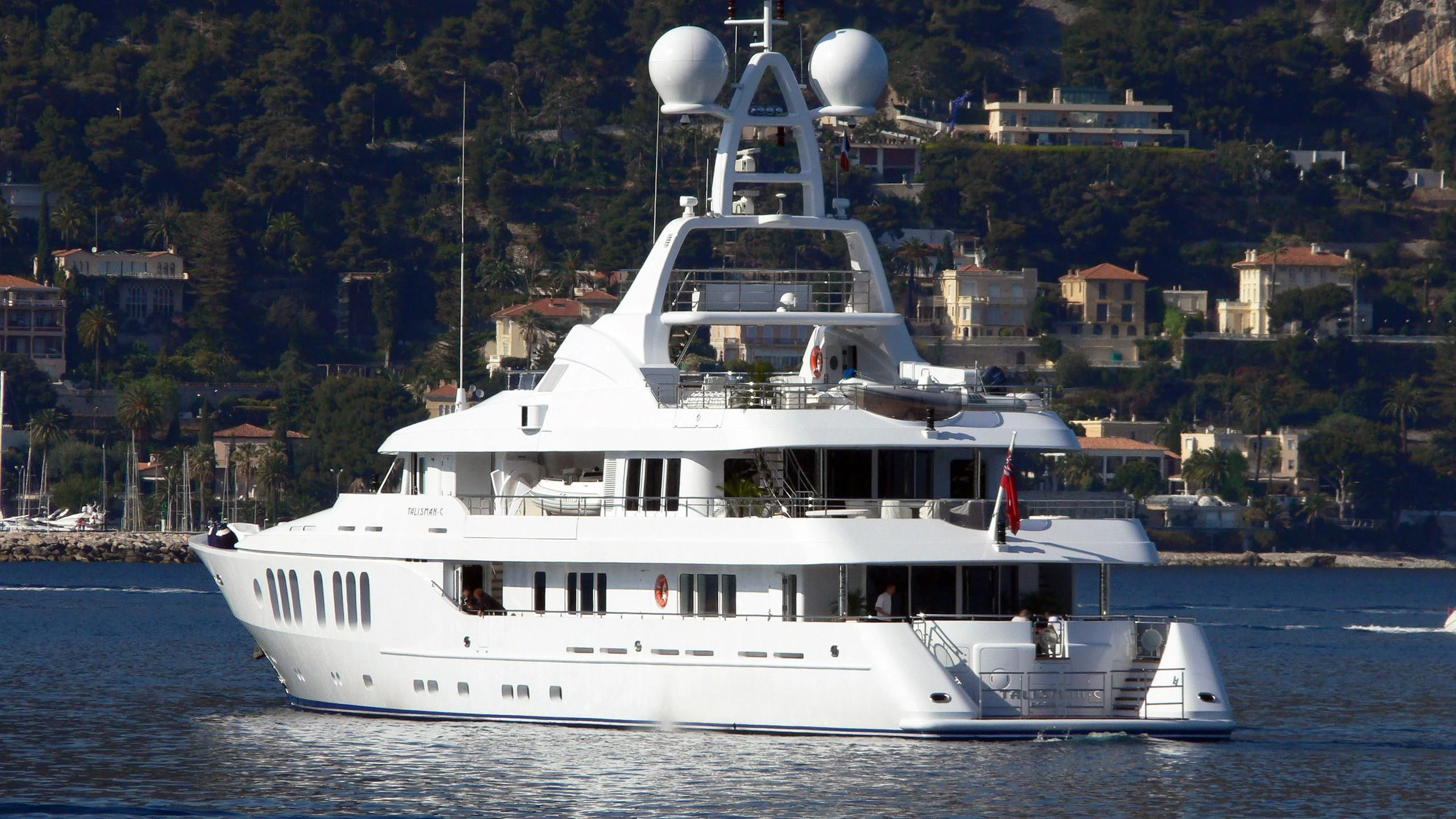 a large white boat on the water aboard TALISMAN MAITON Yacht for Charter