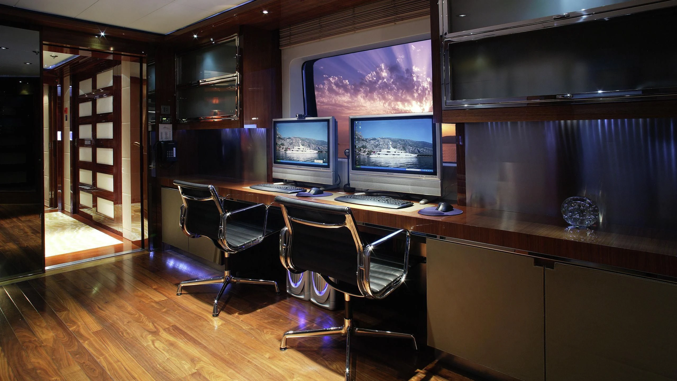 a room with a desk and computer aboard TALISMAN MAITON Yacht for Charter