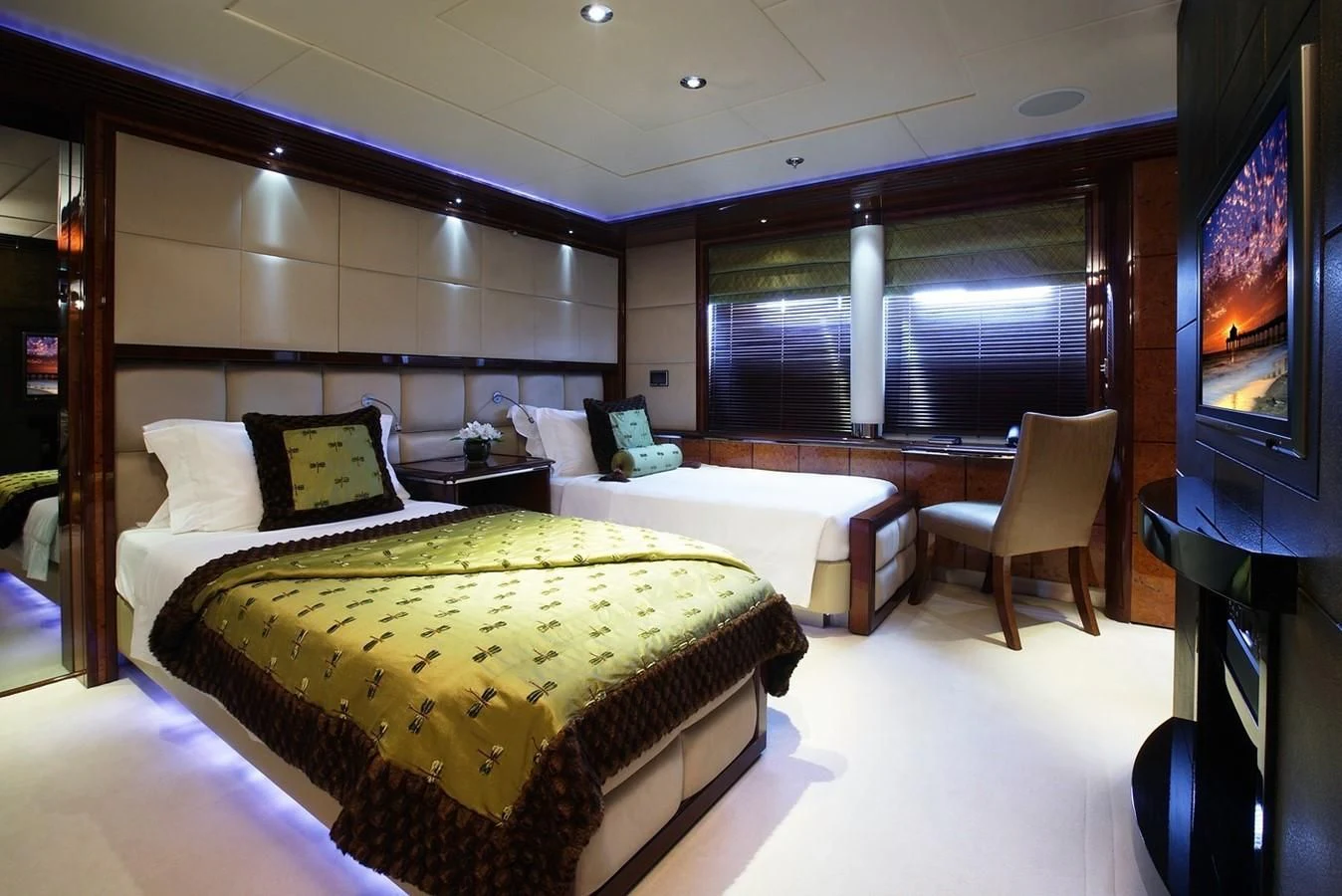 a room with a bed and a tv aboard TALISMAN MAITON Yacht for Charter