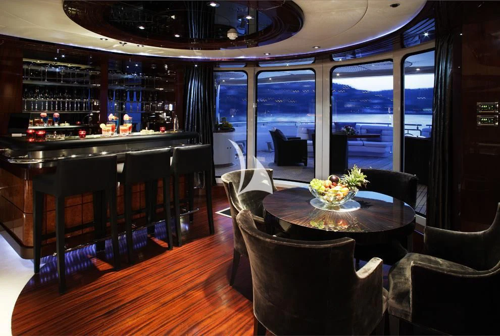a bar with a table and chairs aboard TALISMAN MAITON Yacht for Charter