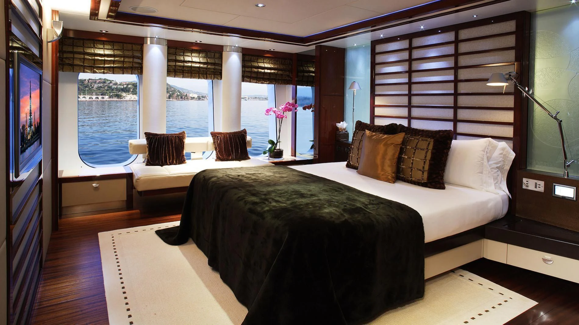 a room with a bed and a tv aboard TALISMAN MAITON Yacht for Charter