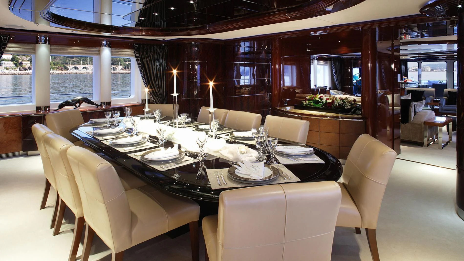 a dining room with a table set aboard TALISMAN MAITON Yacht for Charter