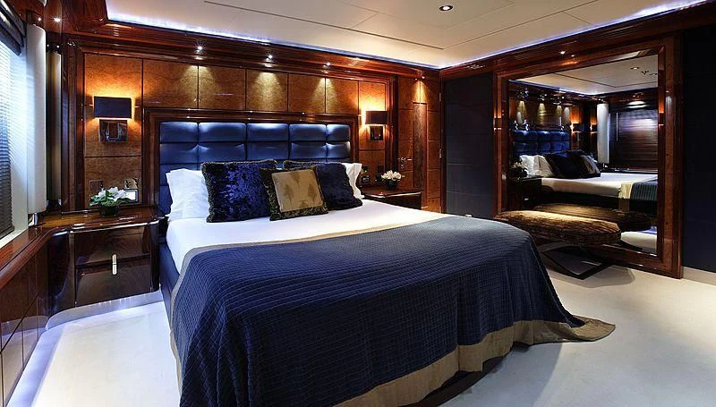 a bedroom with a large bed aboard TALISMAN MAITON Yacht for Charter