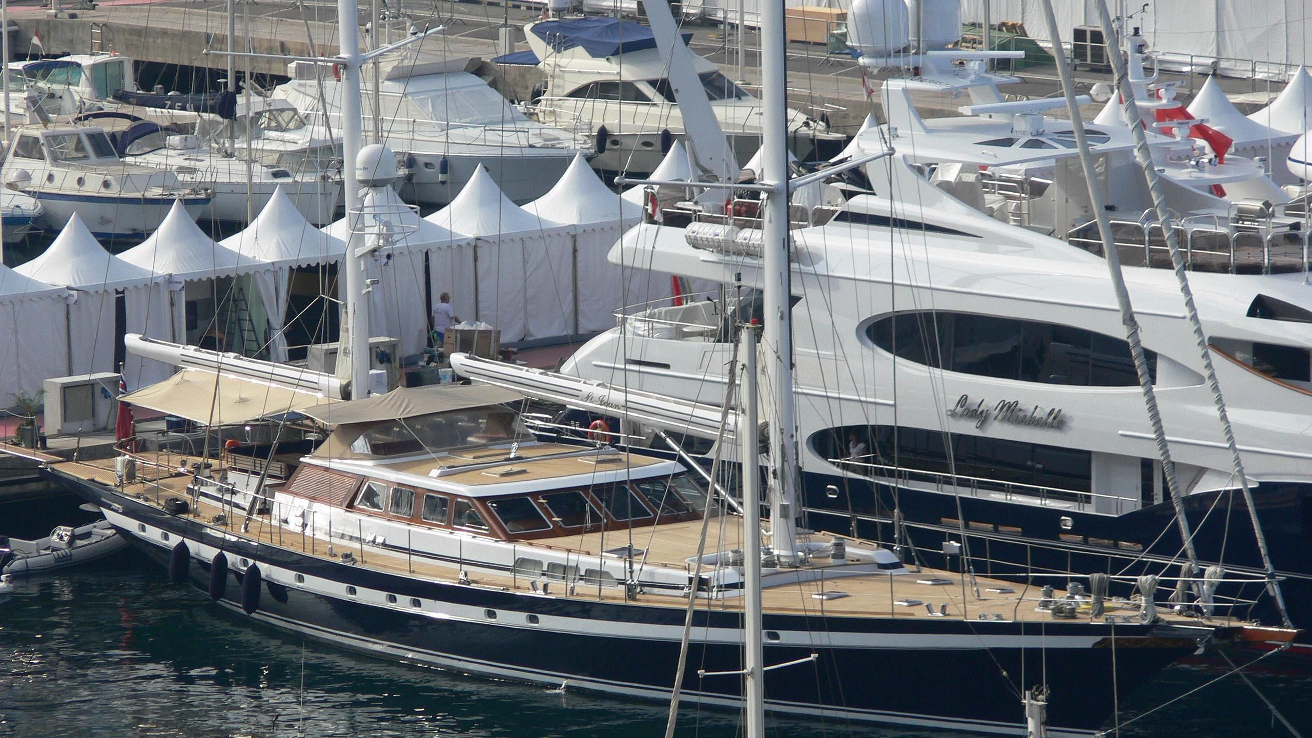 a large white boat sits in a harbor aboard SOUTHWIND OF Yacht for Sale