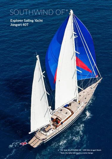 a boat with a red and white sail on the water aboard SOUTHWIND OF Yacht for Sale