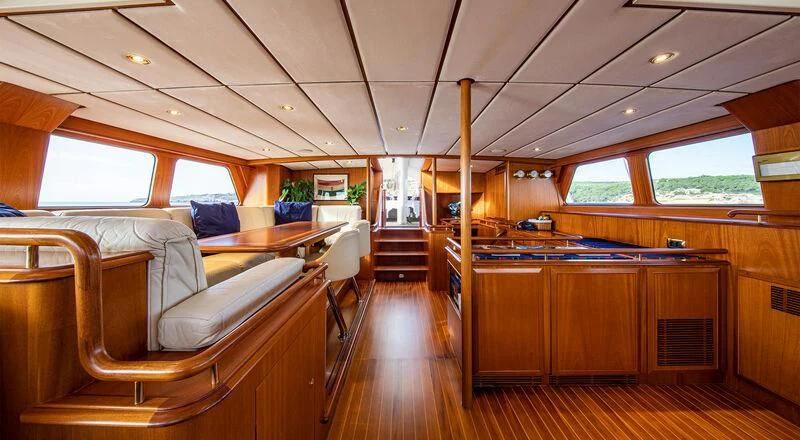 a room with a couch and a table aboard SOUTHWIND OF Yacht for Sale