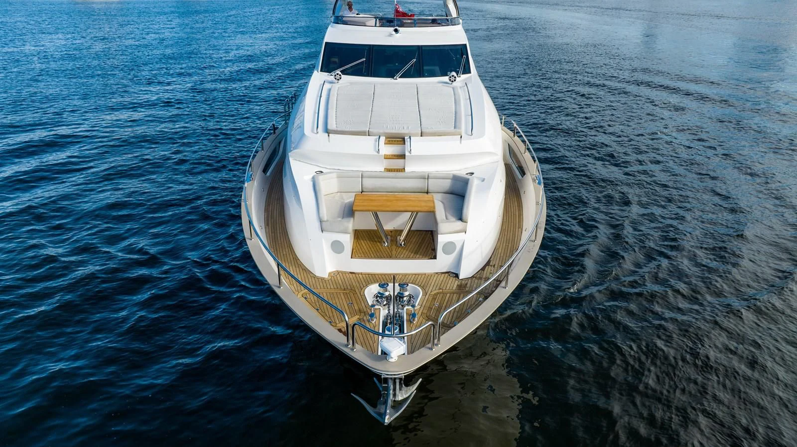 a white boat in the water aboard ROMANI Yacht for Sale