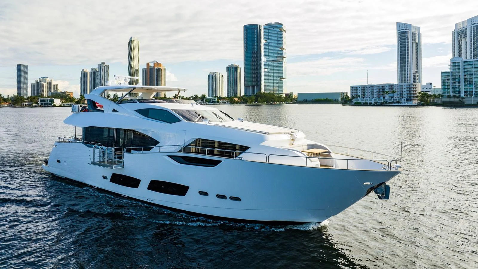 a white yacht on the water aboard ROMANI Yacht for Sale