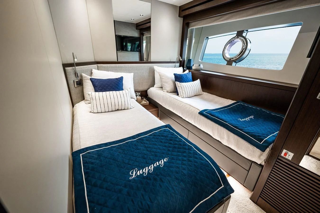a room with a bed and a couch aboard ROMANI Yacht for Sale