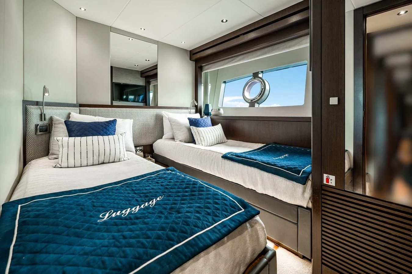 a couple of beds in a room aboard ROMANI Yacht for Sale