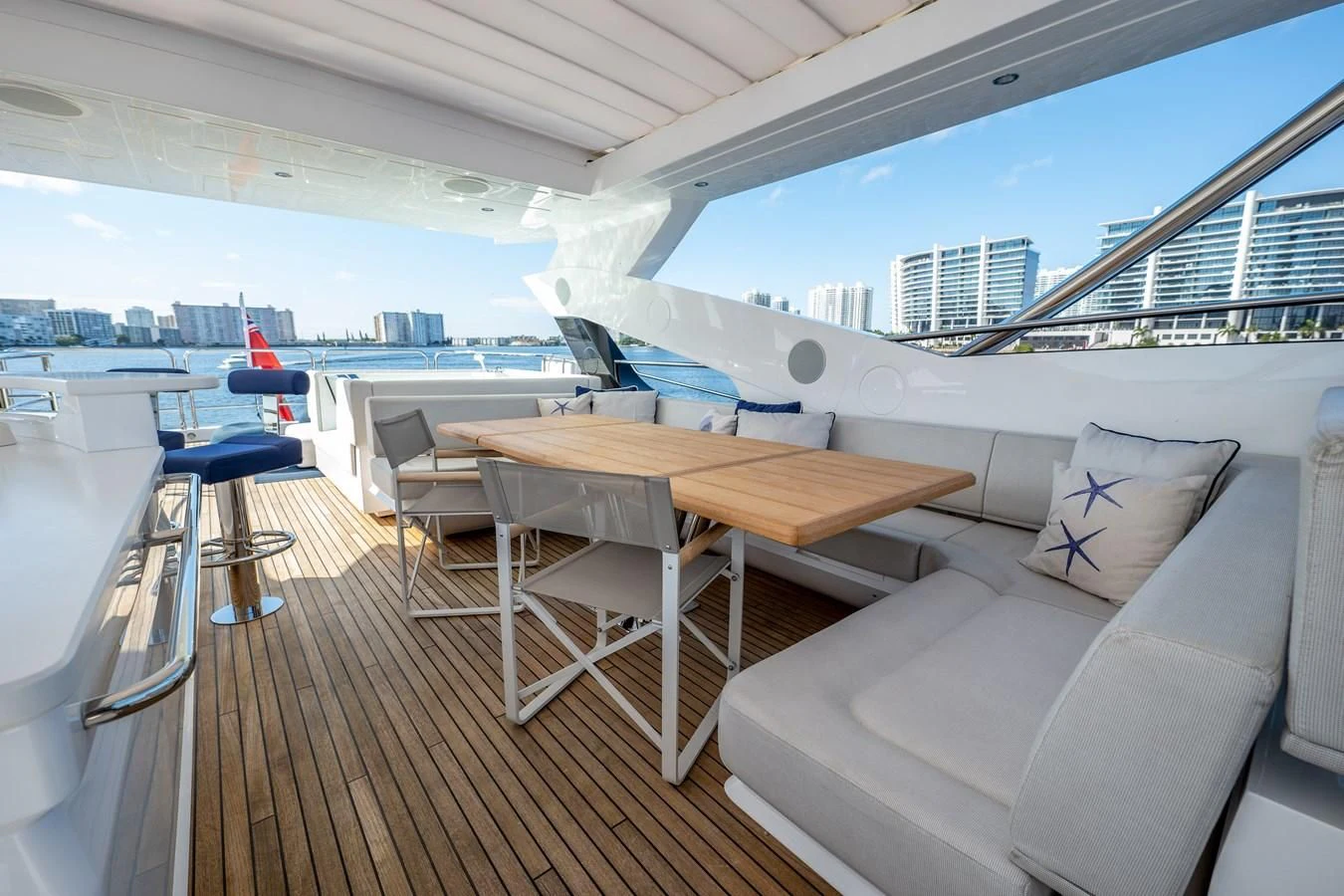 a room with a table and chairs aboard ROMANI Yacht for Sale