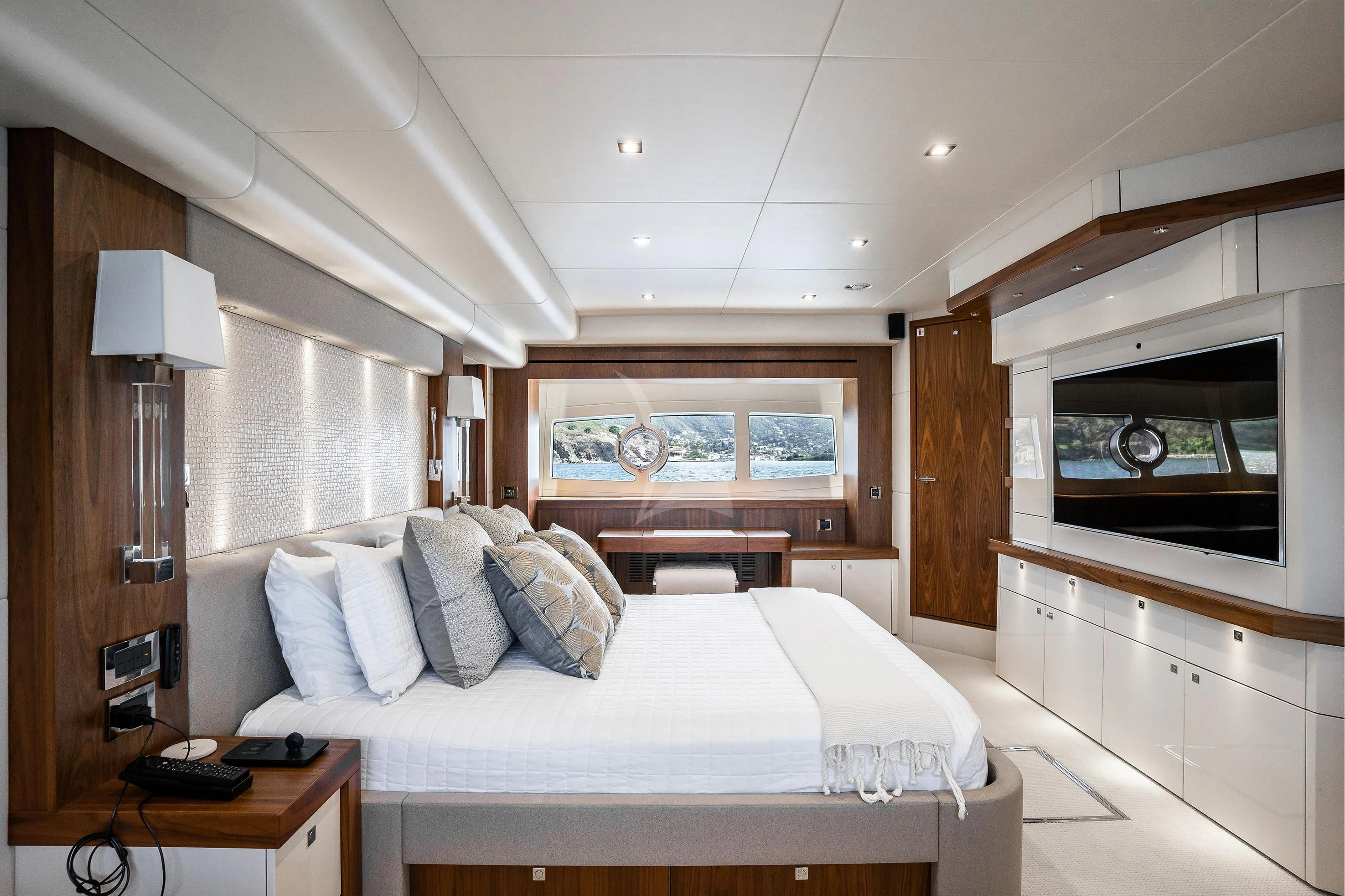 a room with a bed and a television aboard ELITE Yacht for Sale