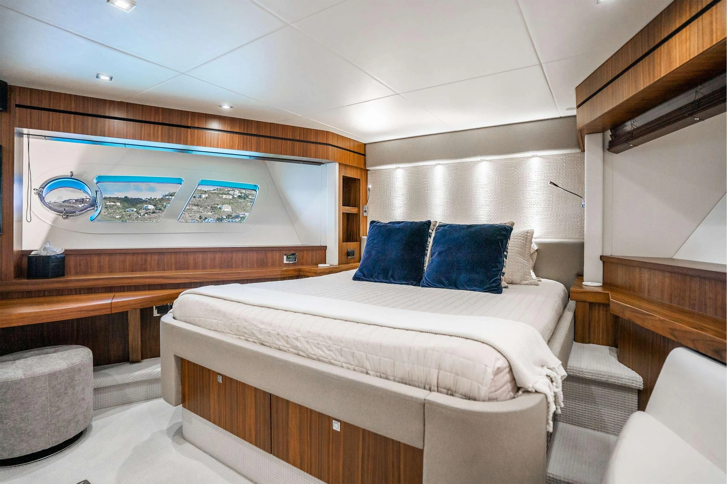 a room with a bed and a television on the wall aboard ELITE Yacht for Sale