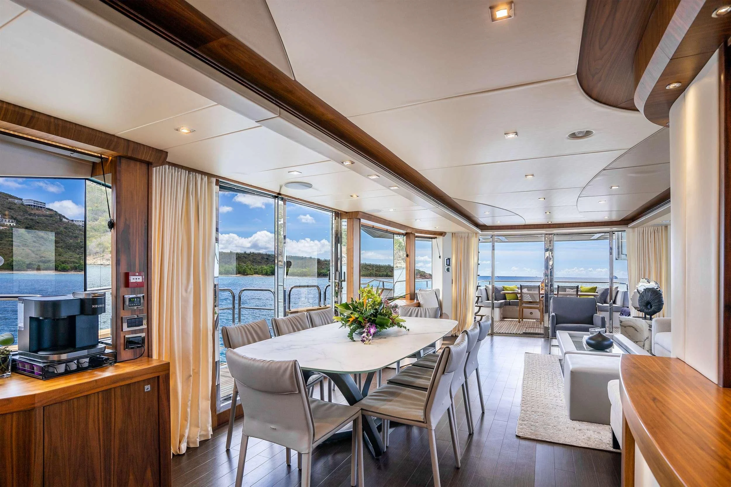 a room with a table and chairs aboard ELITE Yacht for Sale