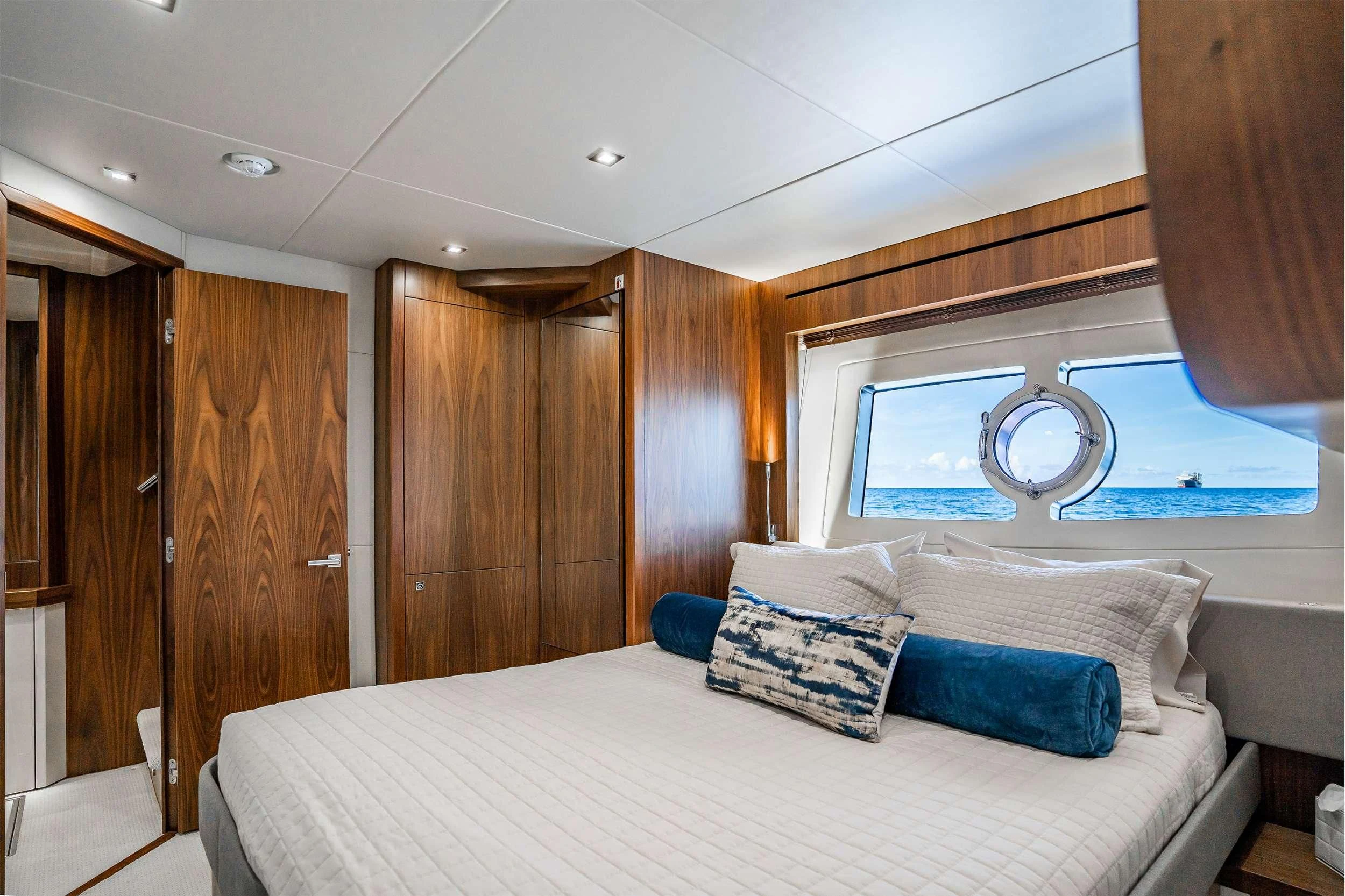 a bed in a room aboard ELITE Yacht for Sale