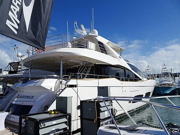 a large white boat in a harbor aboard ELITE Yacht for Sale