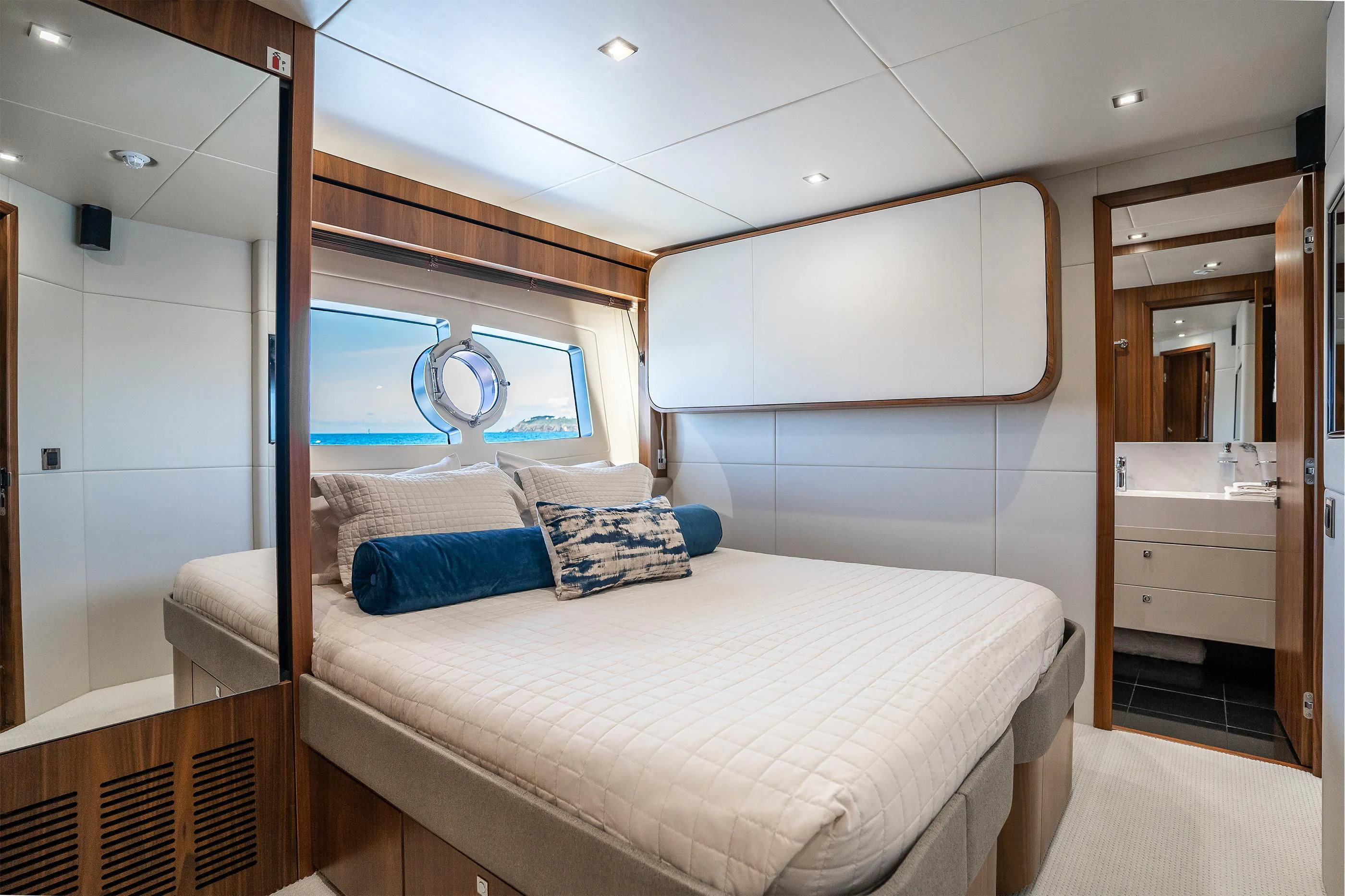 a bedroom with a bed and a window aboard ELITE Yacht for Sale