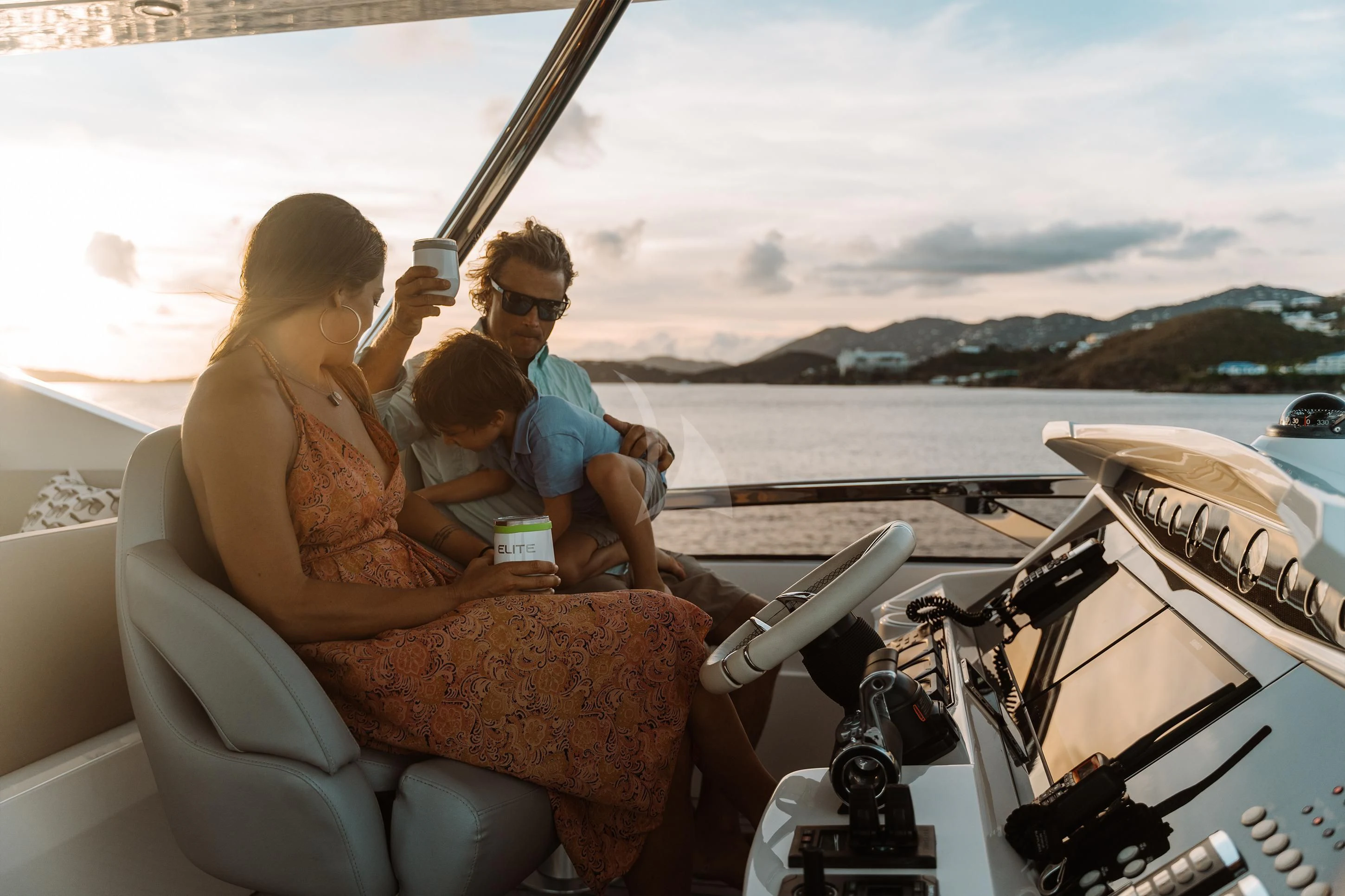 a group of people sitting on a boat aboard ELITE Yacht for Sale