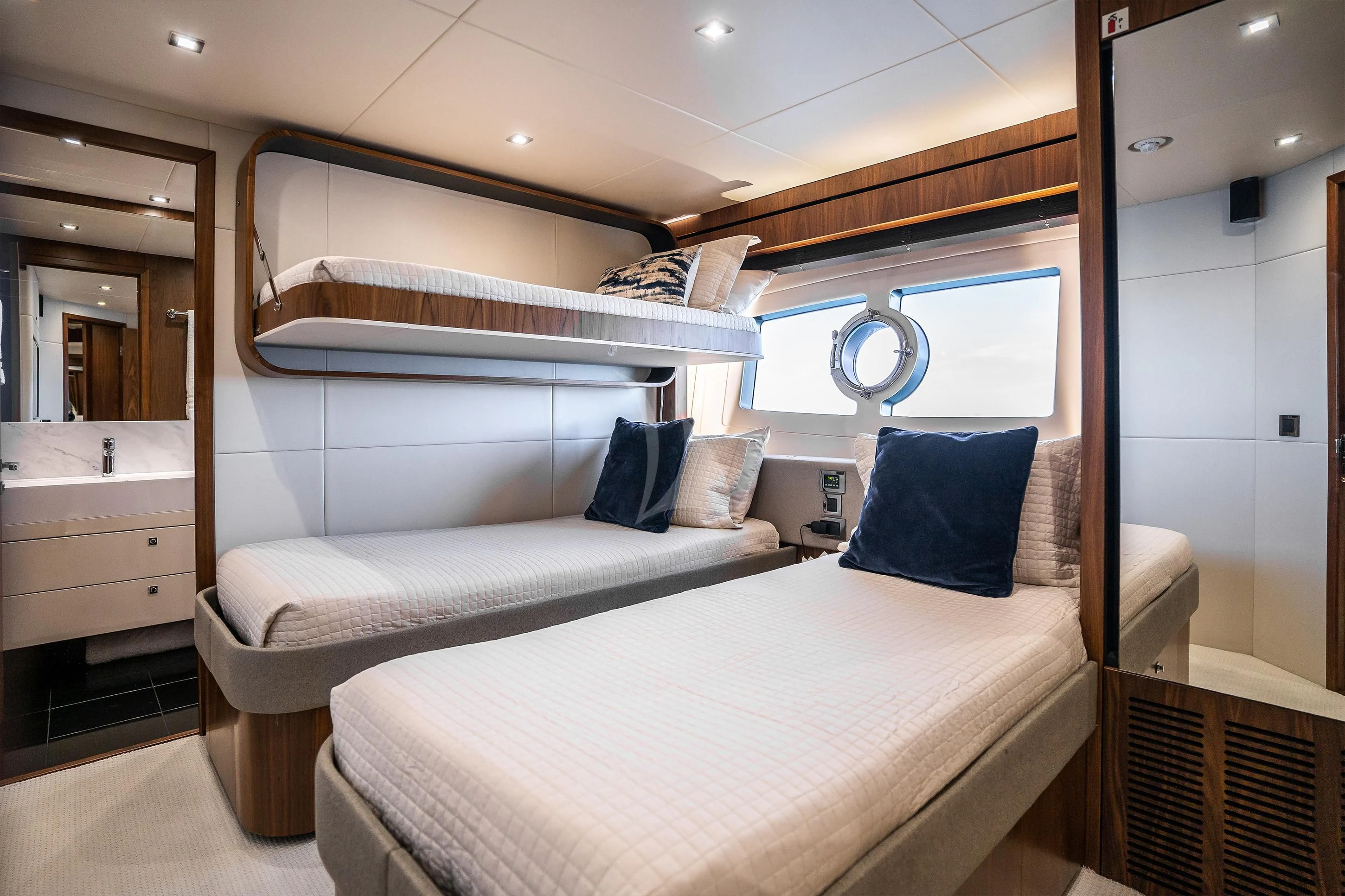 a room with two beds aboard ELITE Yacht for Sale