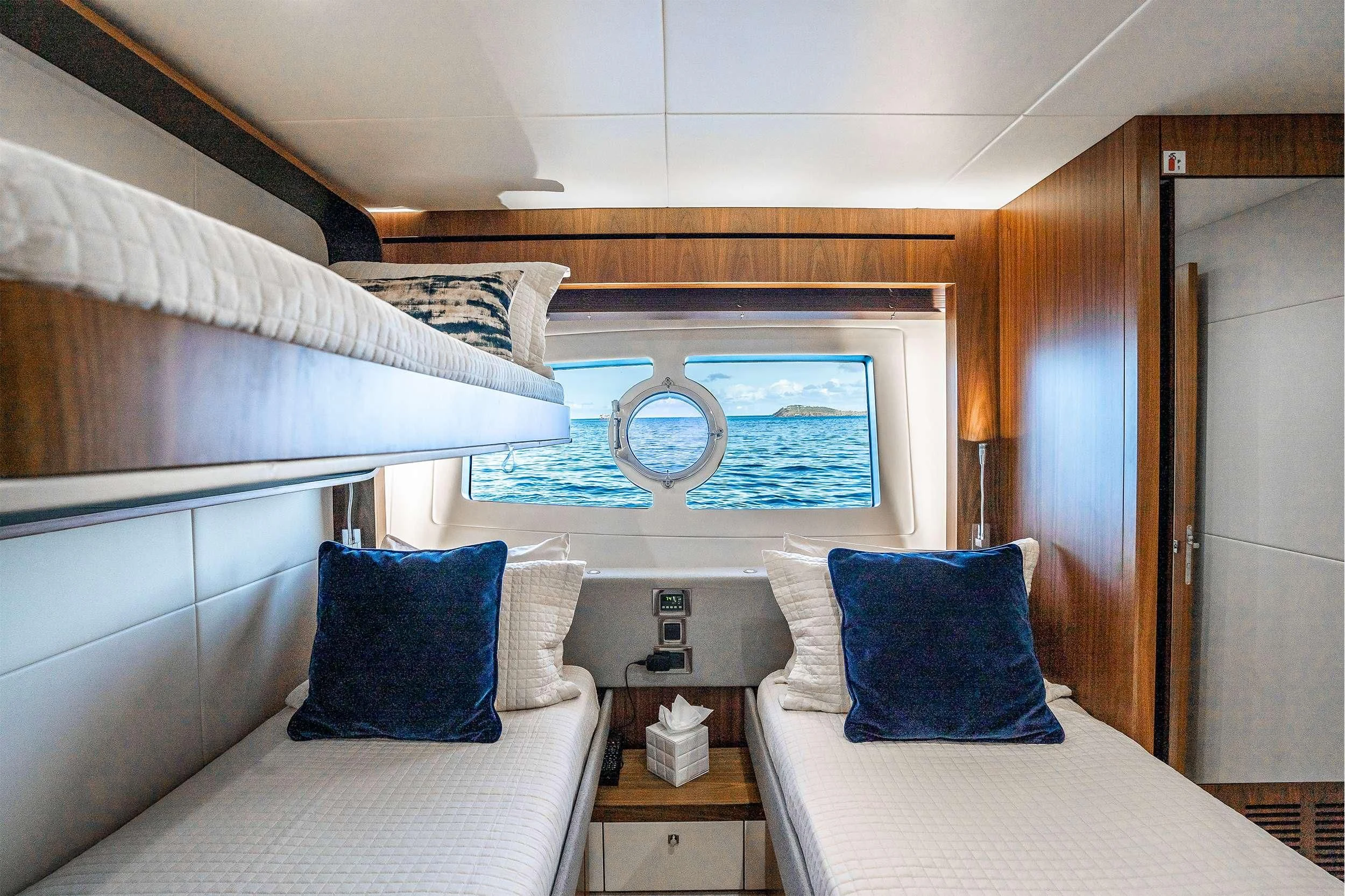 a room with two beds aboard ELITE Yacht for Sale