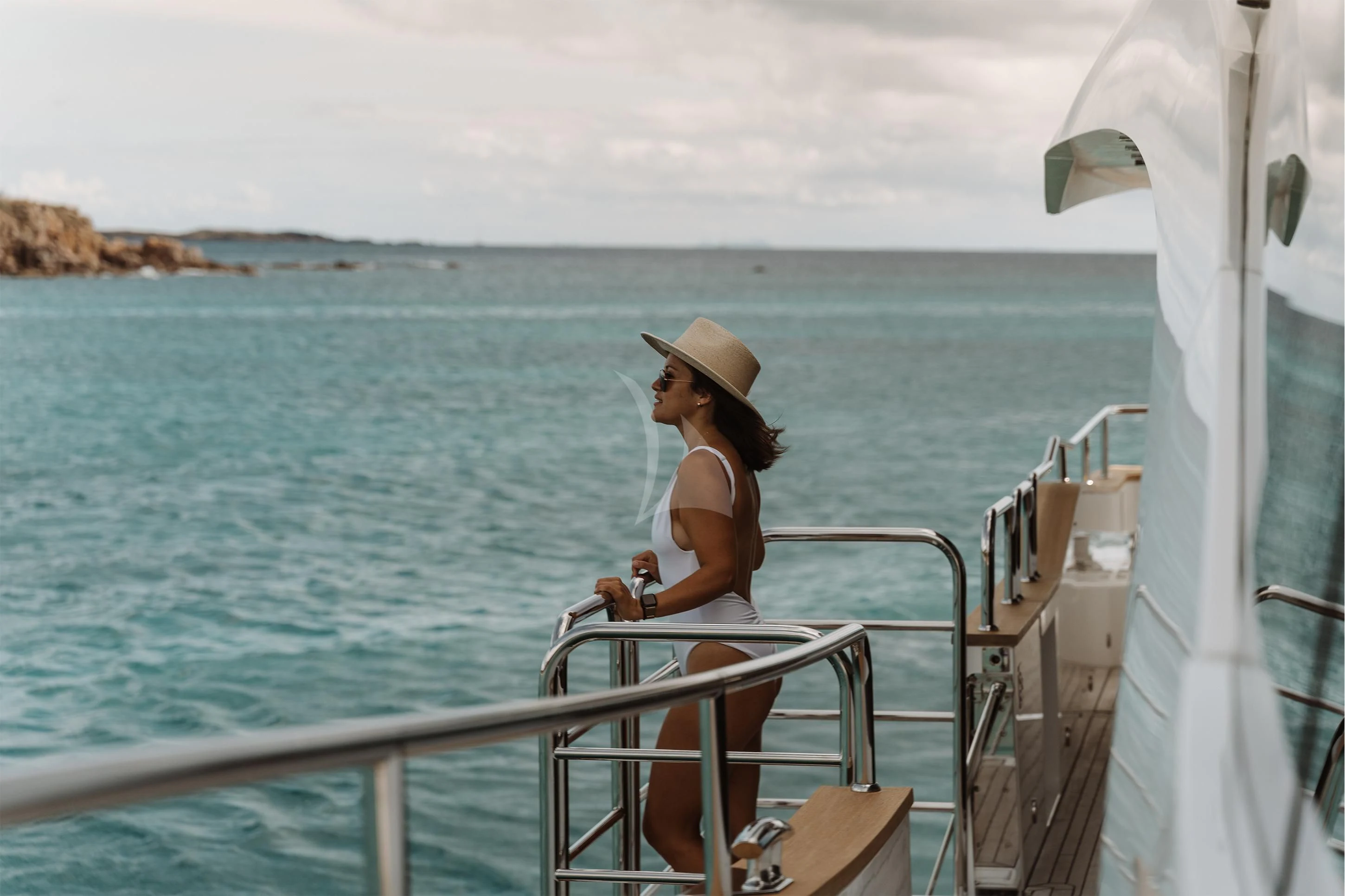 a person sitting on a boat aboard ELITE Yacht for Sale