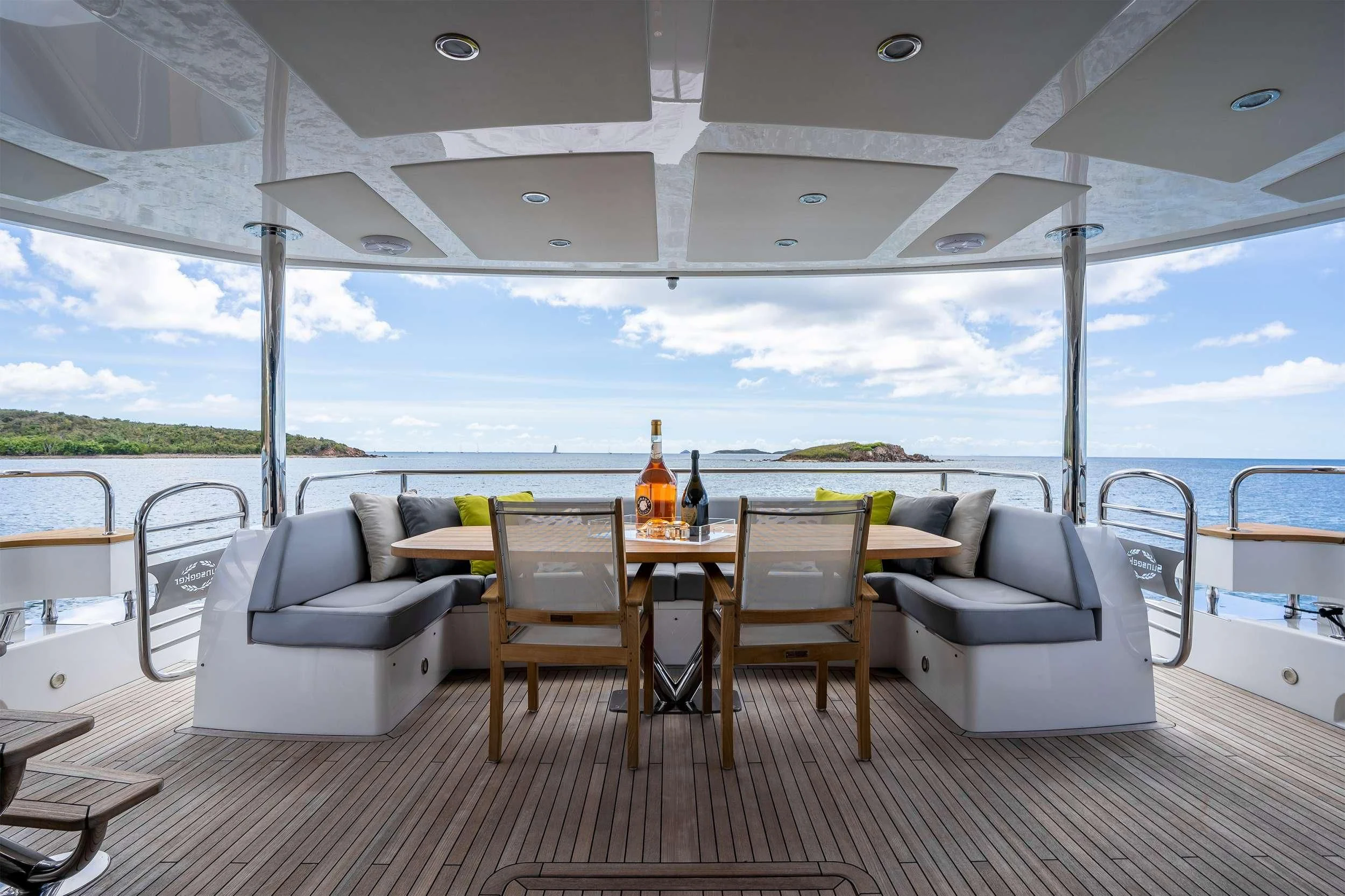 a patio with a table and chairs aboard ELITE Yacht for Sale