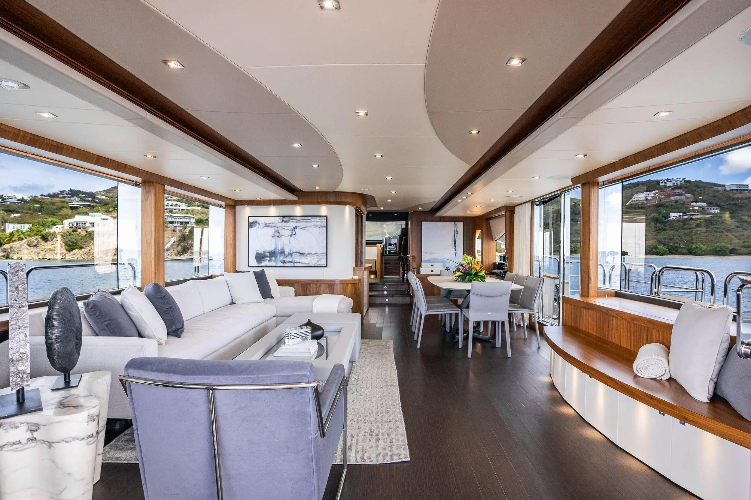 a large living room with a large window aboard ELITE Yacht for Sale