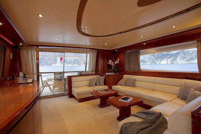 a living room with a large window aboard SOHO Yacht for Sale