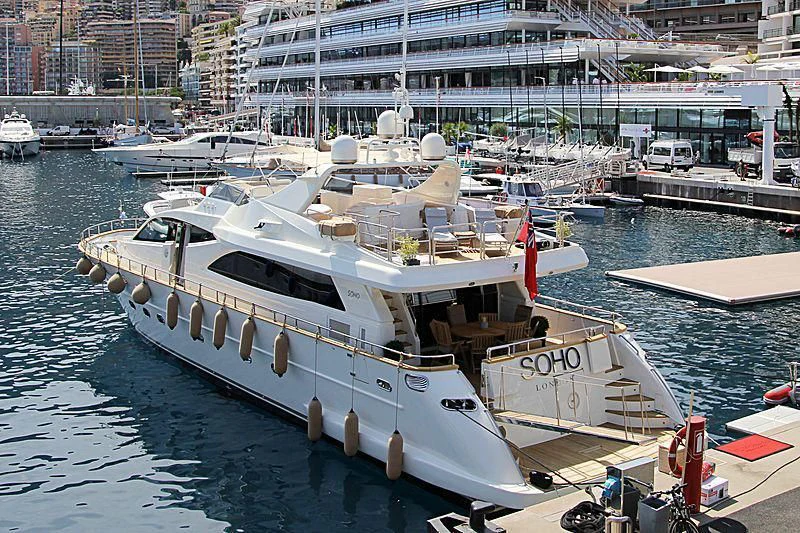 a boat docked at a pier aboard SOHO Yacht for Sale
