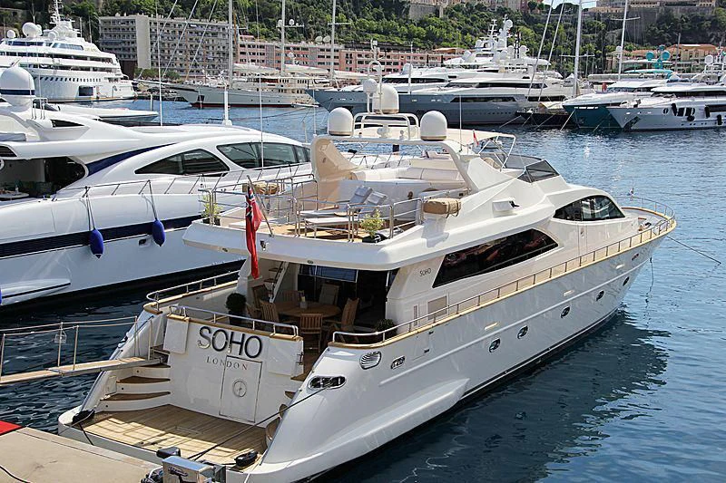 a boat docked at a pier aboard SOHO Yacht for Sale