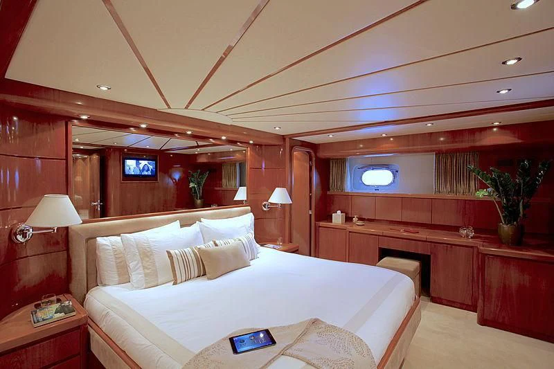 a room with a bed and a desk aboard SOHO Yacht for Sale