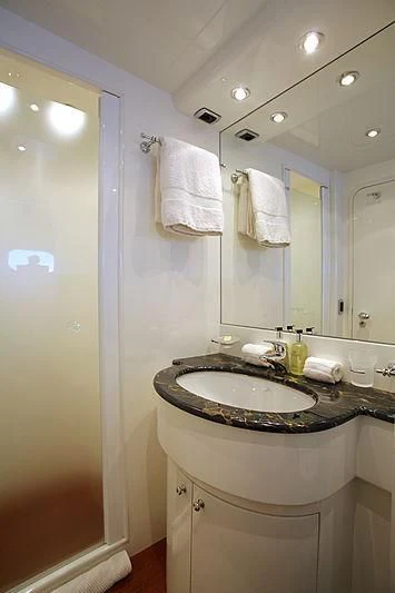 a bathroom with a sink and a mirror aboard SOHO Yacht for Sale