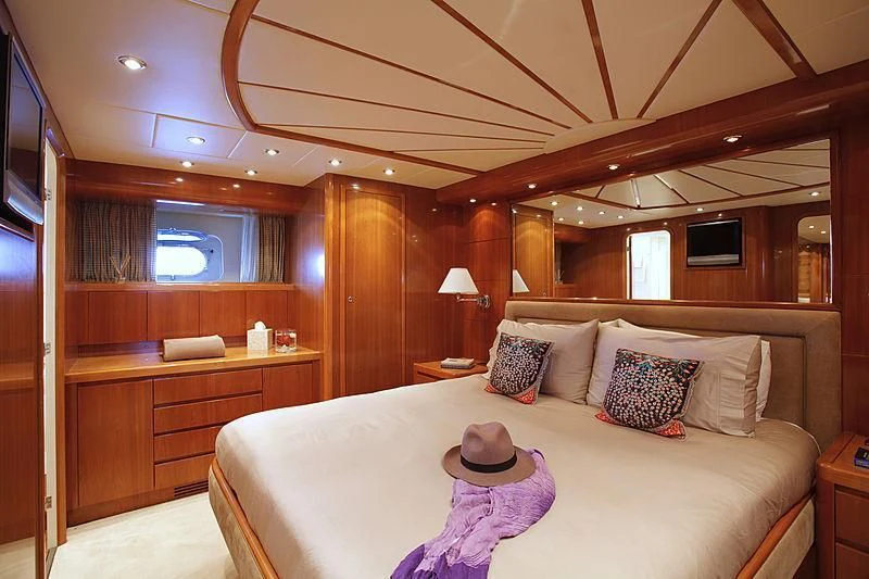 a bed with a hat on it aboard SOHO Yacht for Sale