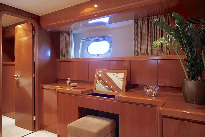 a room with a desk and a window aboard SOHO Yacht for Sale