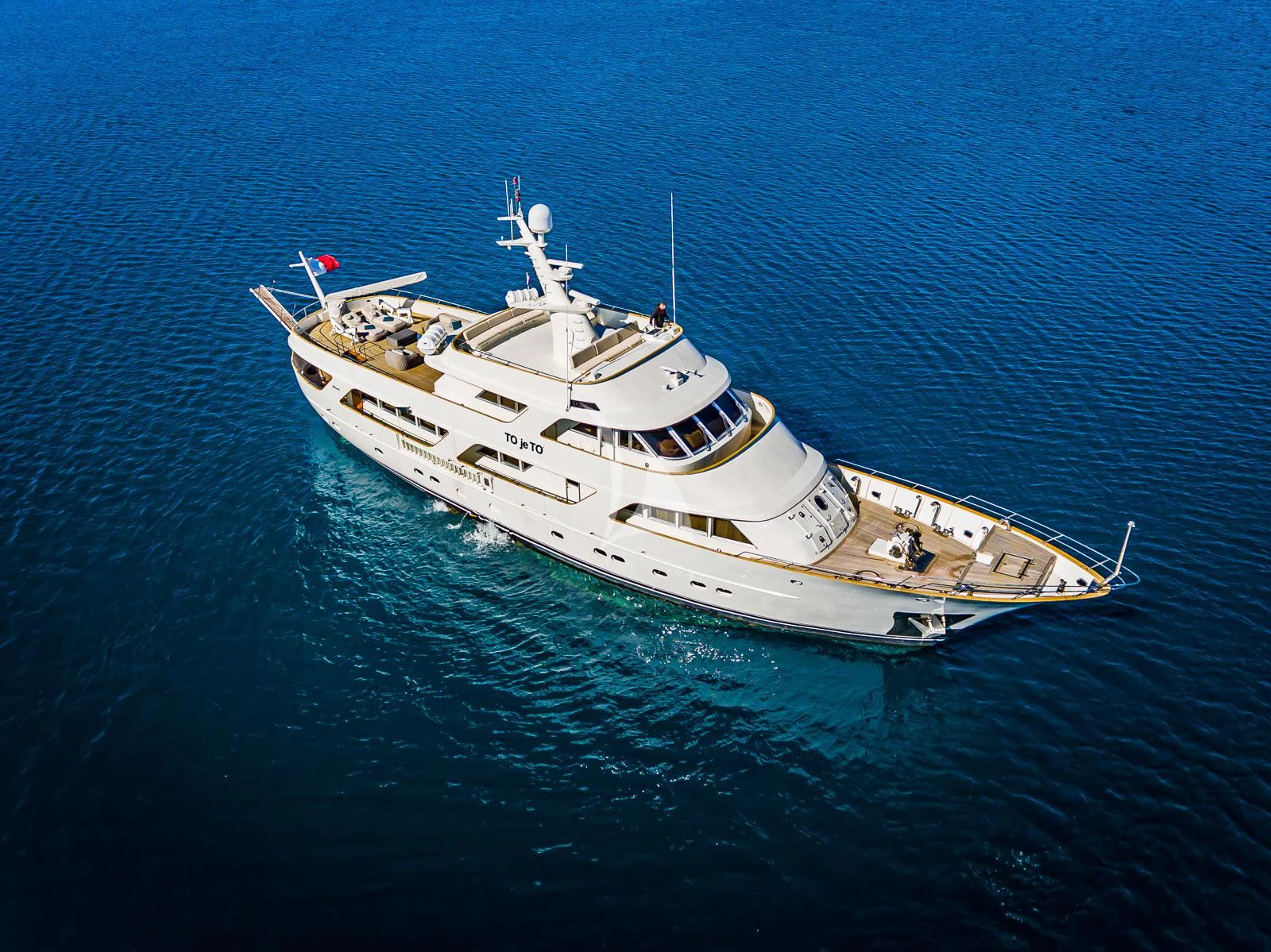 a ship in the water aboard TO JE TO Yacht for Sale