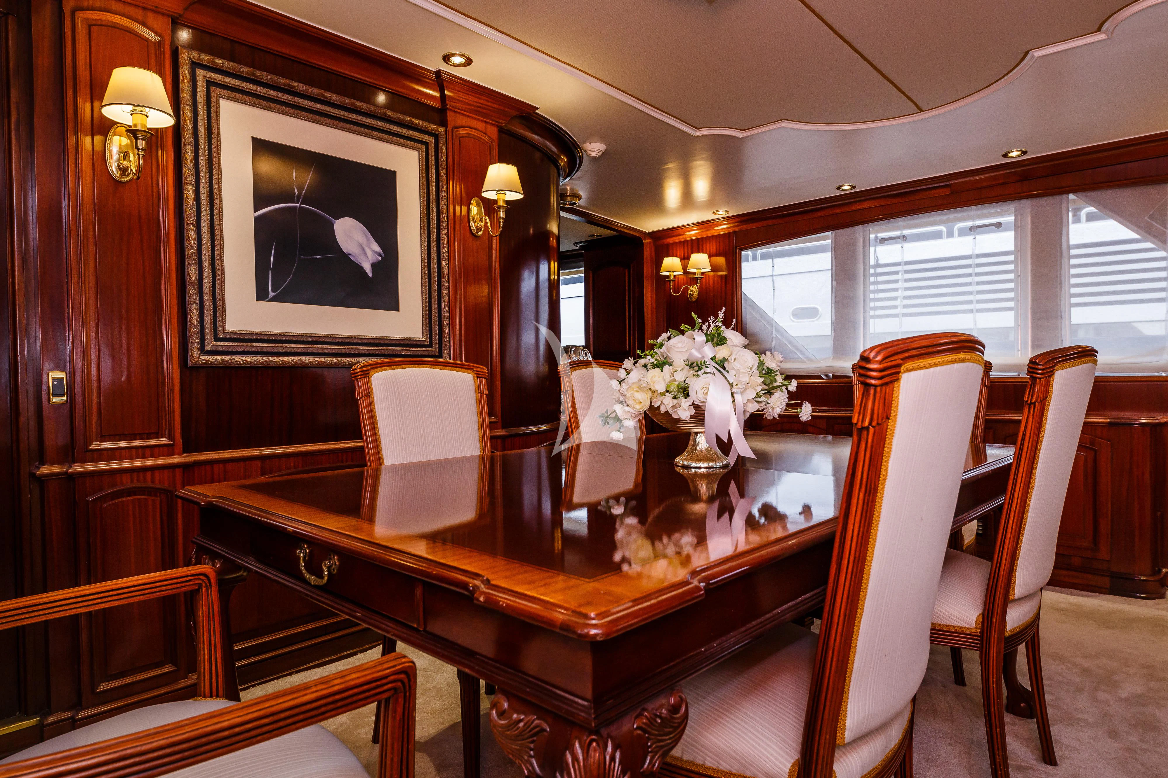 a fancy dining room with a mirror aboard TO JE TO Yacht for Sale
