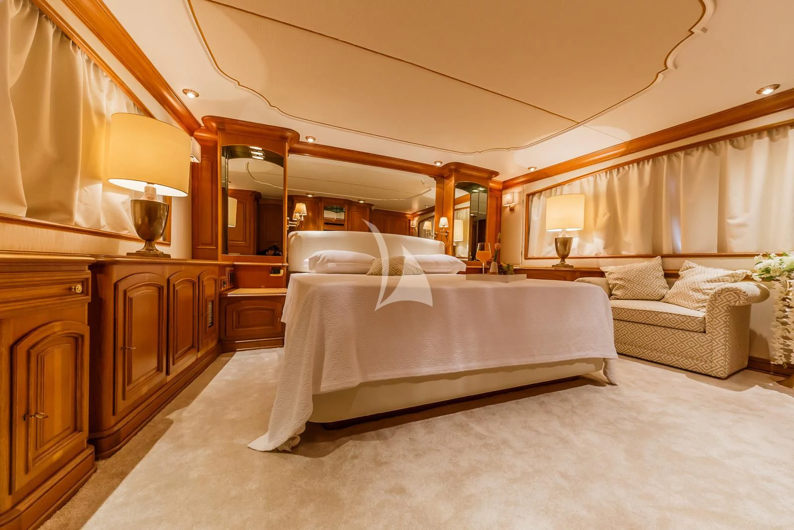 a bedroom with a bed and a couch aboard TO JE TO Yacht for Sale